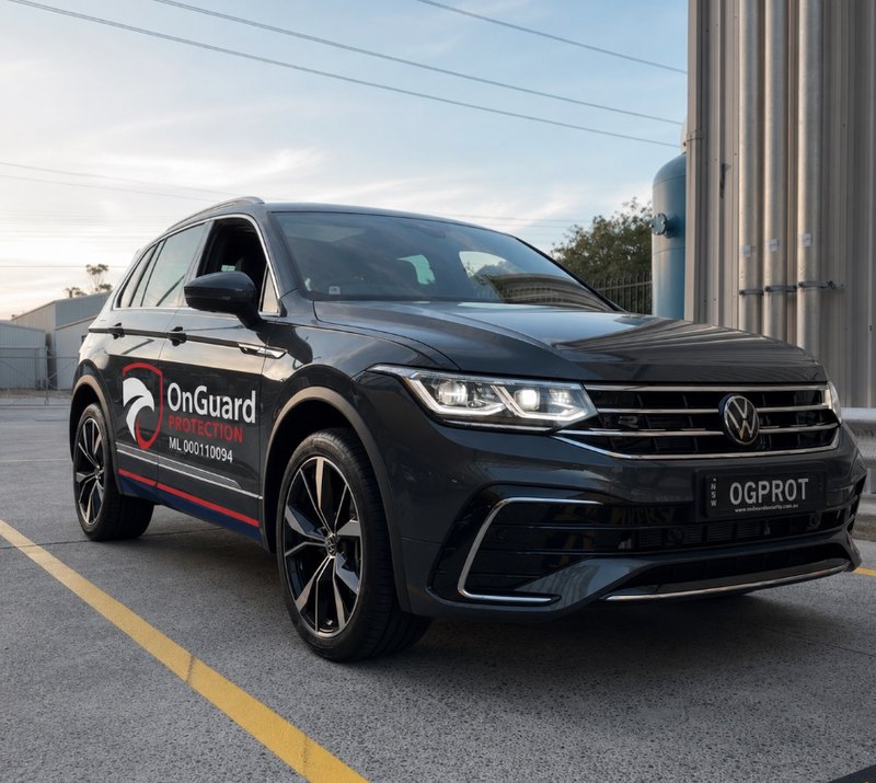 OnGuard Protection marked VW Tiguan patrol vehicle, plates OGPROT, Master Licence 000110094